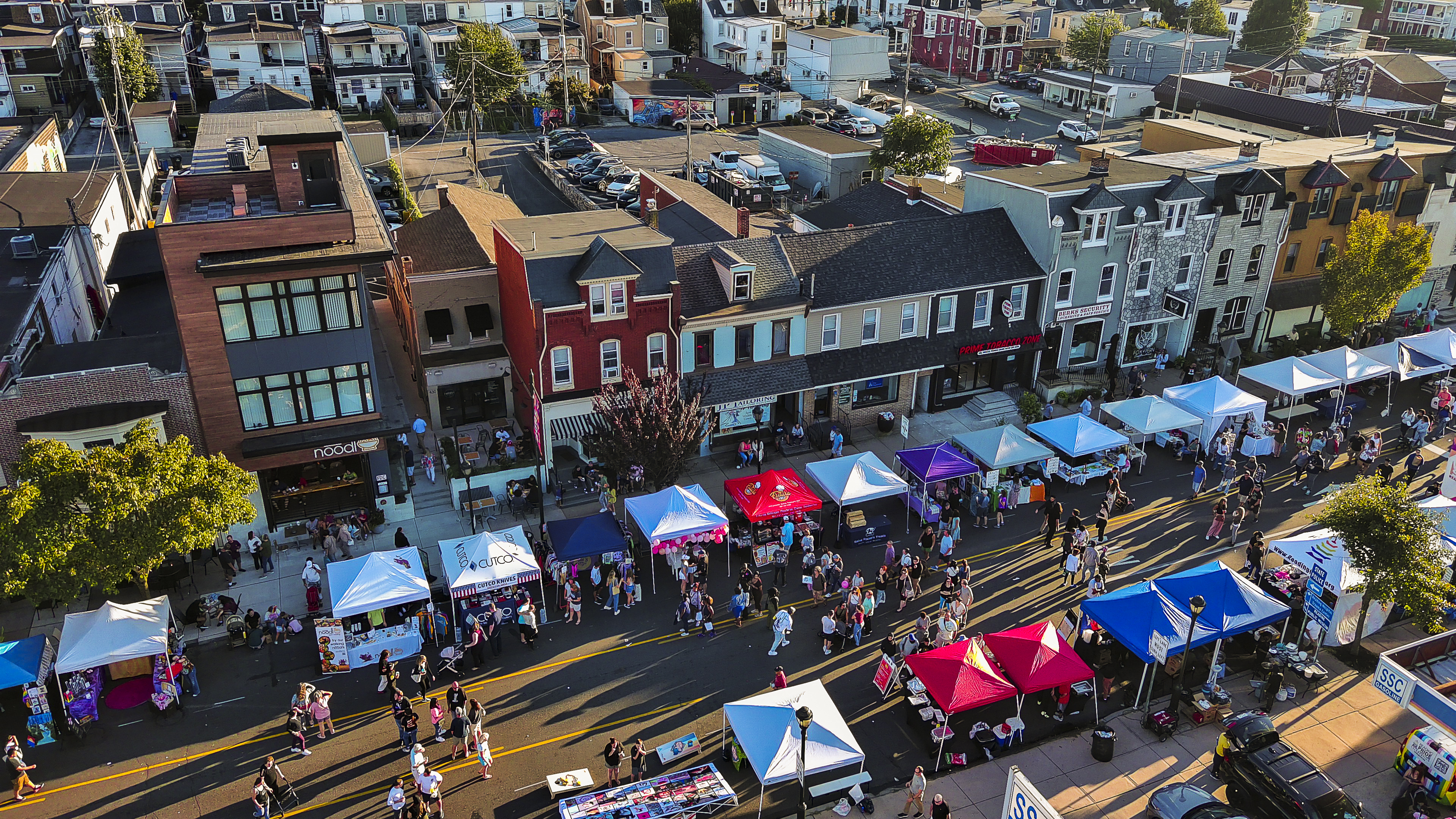 Food stalls and entertainment tents along Penn Avenue on Fall Festival in West Reading, Pennsylvania, USA