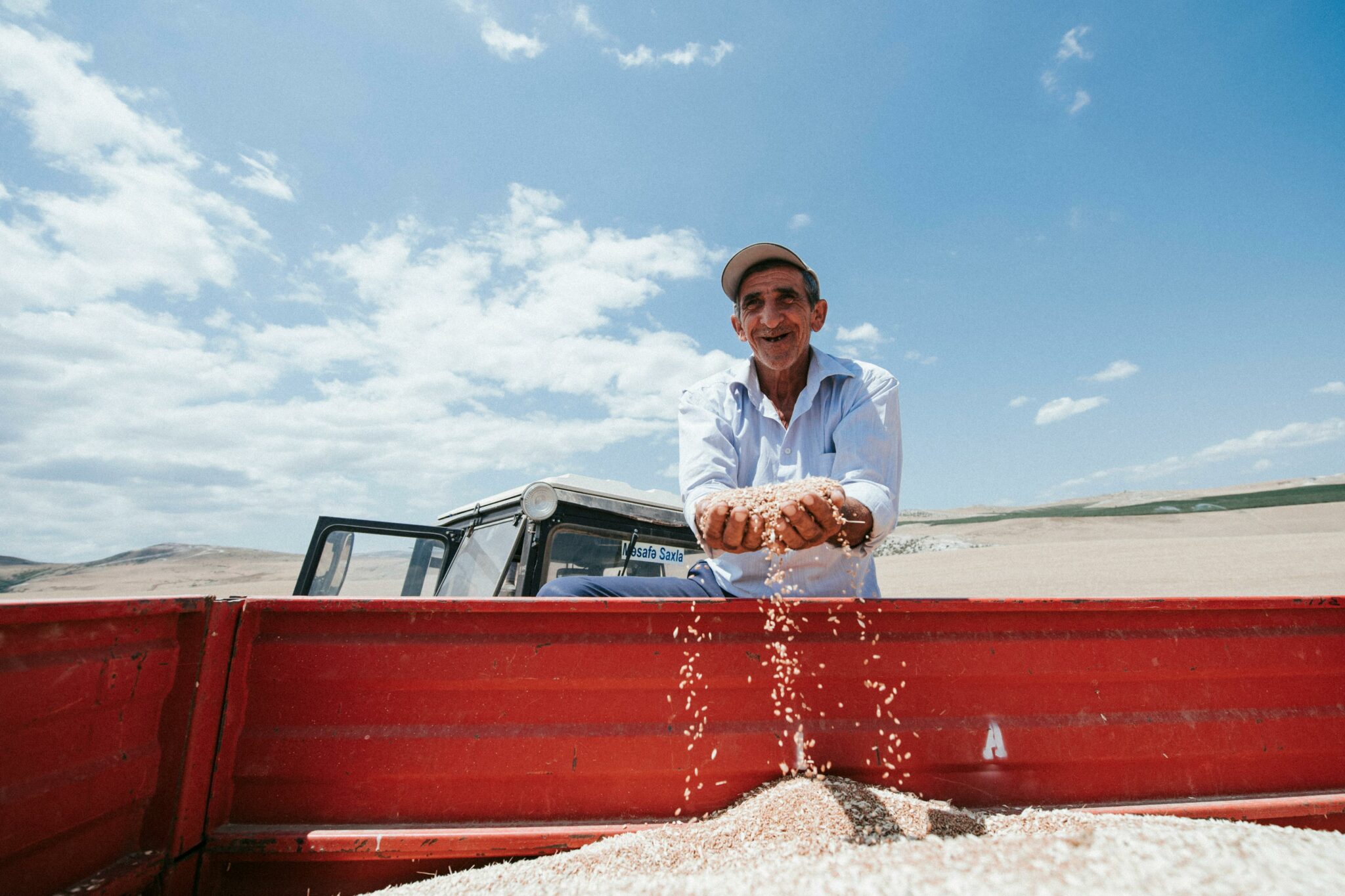A man holds planting seeds in his hands